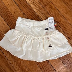 Brand new! Infant girl (12 months) cream skirt (with shorts insert)